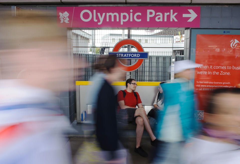 Passengers follow signs to the Olympic Park as they arrive at Stratford station, in east London, Saturday July 28, 2012. (AP Photo/Dominic Lipinski, PA) UNITED KINGDOM OUT; NO SALES; NO ARCHIVE