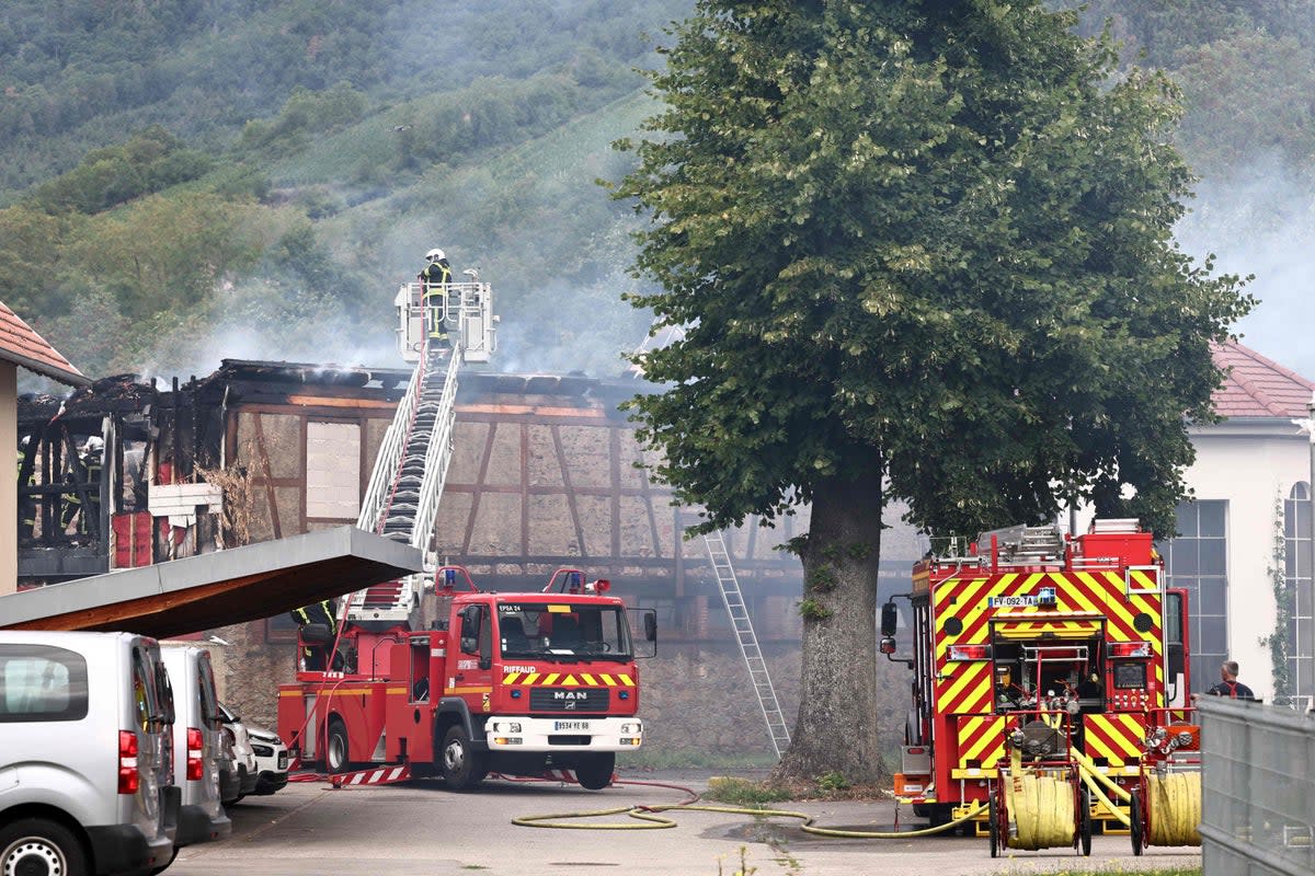 Firefighters tackling a fire that erupted at a home for disabled people in Wintzenheim near Colmar, eastern France (AFP via Getty Images)