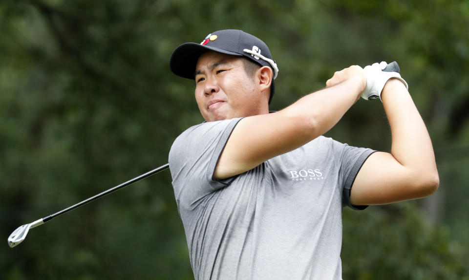 Byeong Hun An watches his tee shot on the fourth hole hole during the third round of the Wyndham Championship golf tournament at Sedgefield Country Club in Greensboro, N.C. Saturday, Aug. 3, 2019. (AP Photo/Chris Seward)