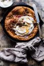 <p>Transform <a href="https://www.countryliving.com/food-drinks/g3792/sweet-potato-pie/" rel="nofollow noopener" target="_blank" data-ylk="slk:sweet potato pie;elm:context_link;itc:0;sec:content-canvas" class="link ">sweet potato pie</a> into a pancake topped with a maple-infused whipped cream and a candied pecan streusel.</p><p><strong>Get the recipe at <a href="https://www.halfbakedharvest.com/sweet-potato-pie-dutch-baby/" rel="nofollow noopener" target="_blank" data-ylk="slk:Half Baked Harvest;elm:context_link;itc:0;sec:content-canvas" class="link ">Half Baked Harvest</a>.</strong></p>