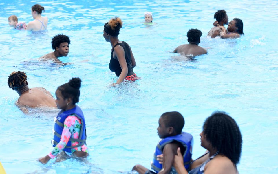 People in the pool at Querbes Park Recreation Center on June 8, 2022.