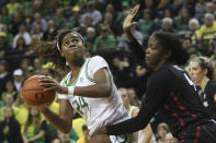 Oregon's Ruthy Hebard, left, looks for a shot against Stanford's Nadia Fingall during the second quarter of an NCAA college basketball game in Eugene, Ore., Thursday, Jan. 16, 2020. (AP Photo/Chris Pietsch)