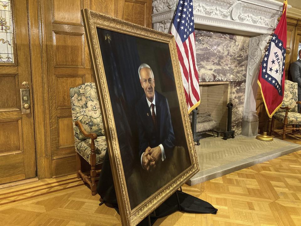 The official portrait of Gov. Asa Hutchinson, made by New Orleans painter Michael Deas, is displayed at a news conference at the state Capitol in Little Rock, Ark., on Tuesday, Jan. 3, 2023. (AP Photo/Andrew DeMillo)