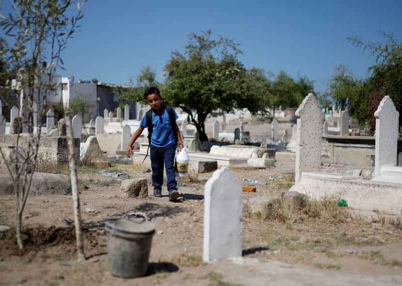 The Wider Image: Gaza struggles to accommodate the living and the dead as population grows