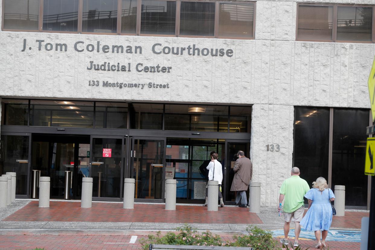 People enter the J. Tom Coleman Courthouse on Tuesday April 25, 2023.