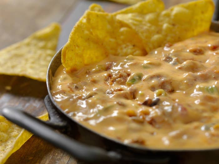 Cheese dip with tortilla chips.
