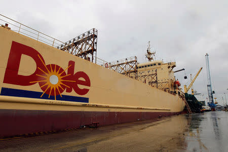 FILE PHOTO: A Dole vessel transporting containers with boxes of bananas is anchored at Dole's Port in Guayaquil, Ecuador, February 23, 2012. REUTERS/Guillermo Granja/File Photo