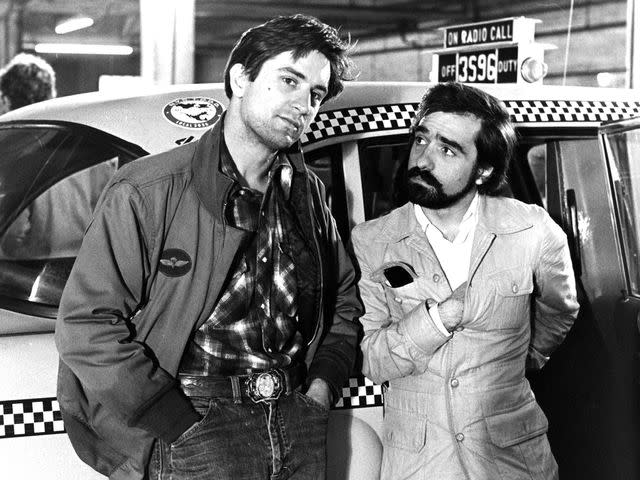 <p>Columbia Pictures/Getty</p> Robert De Niro and Martin Scorsese on the set of 'Taxi Driver' in 1976