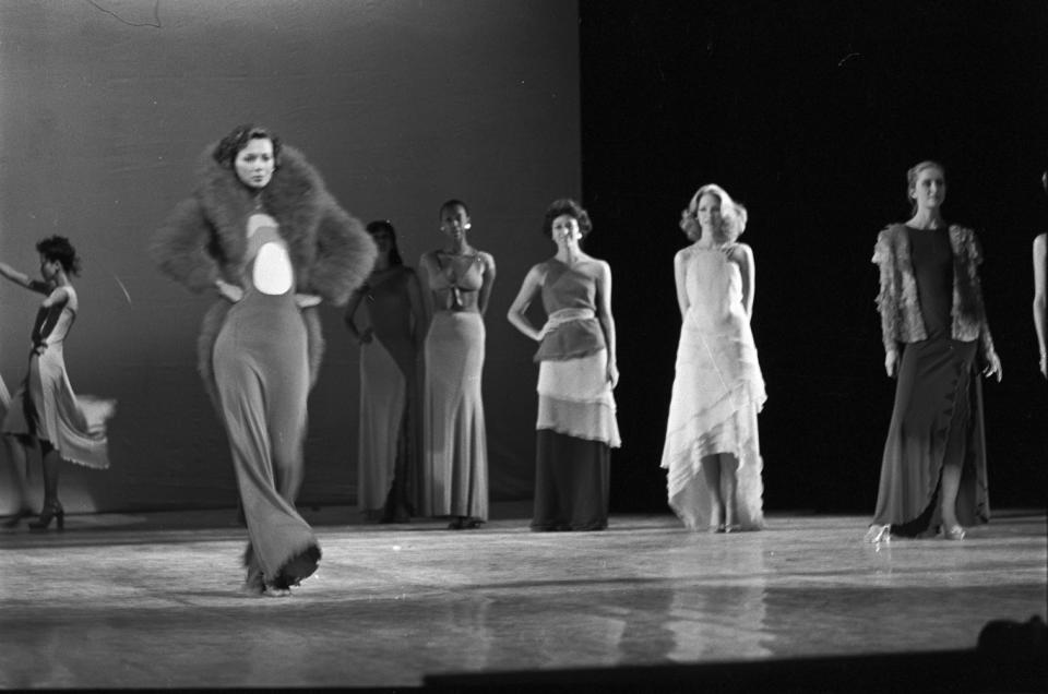 Outtake; Models dressed in fur and gowns take the stage during the fashion show to benefit the restoration of the Chateau of Versailles, five American designers matching talents with five French couturiers at the Versailles Palace on November 28, 1973 in Versailles, France...Article title: "One night and pouf! It's gone!"