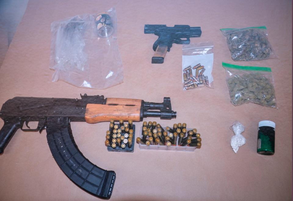 A police photograph of items confiscated from Devon Jamal Graham when he was arrested in connection with the shooting at The Gardens Mall in Palm Beach Gardens, Florida.