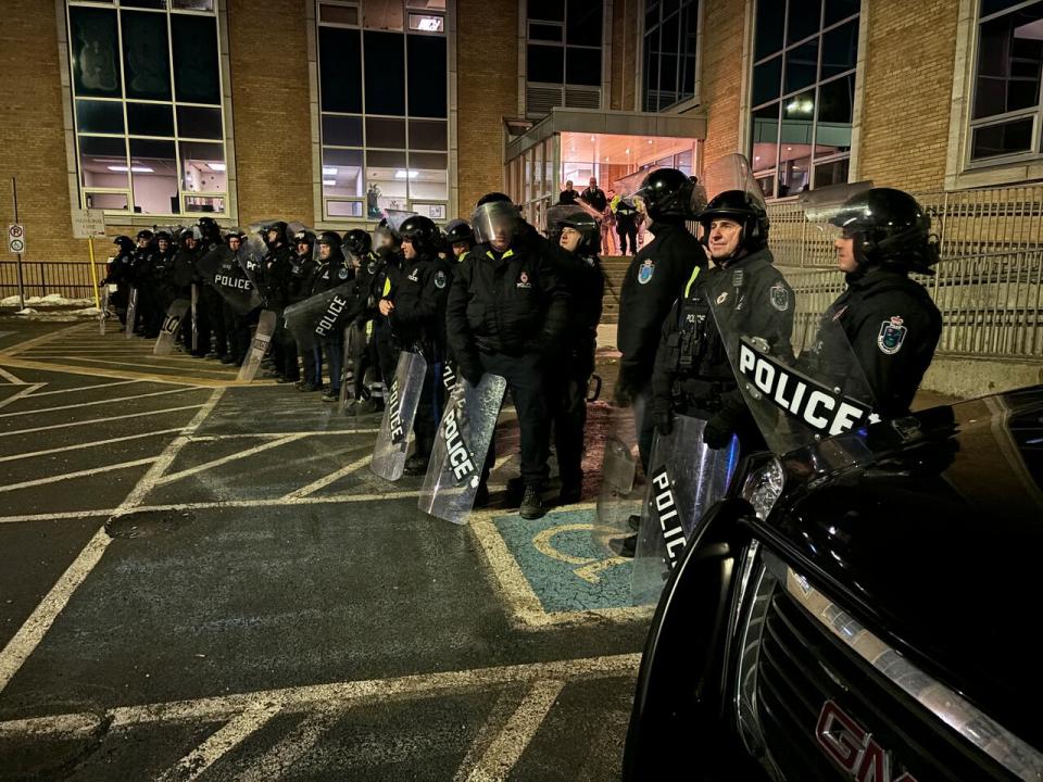 Police in riot gear guard an entrance to Confederation Building on Thursday morning in St. John's, as the provincial government makes a second attempt to introduce a budget.