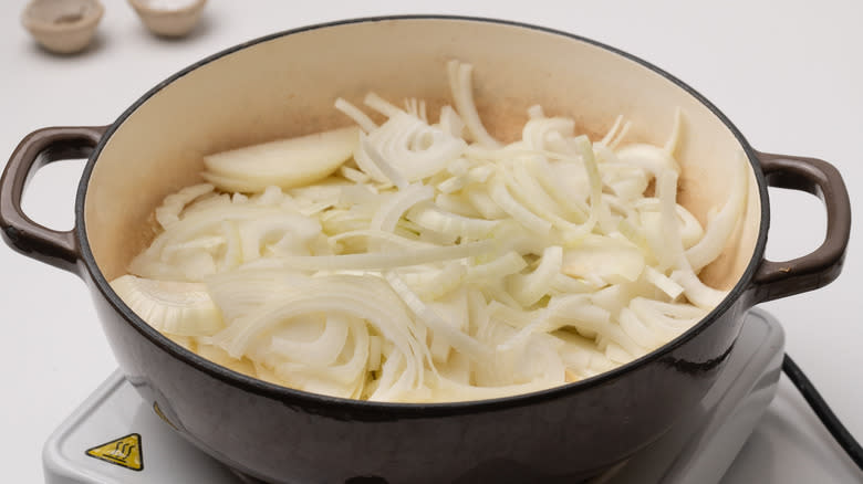 sliced onions in a pan