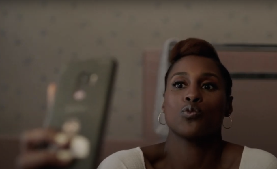 Issa Rae takes a selfie while puckering her lips