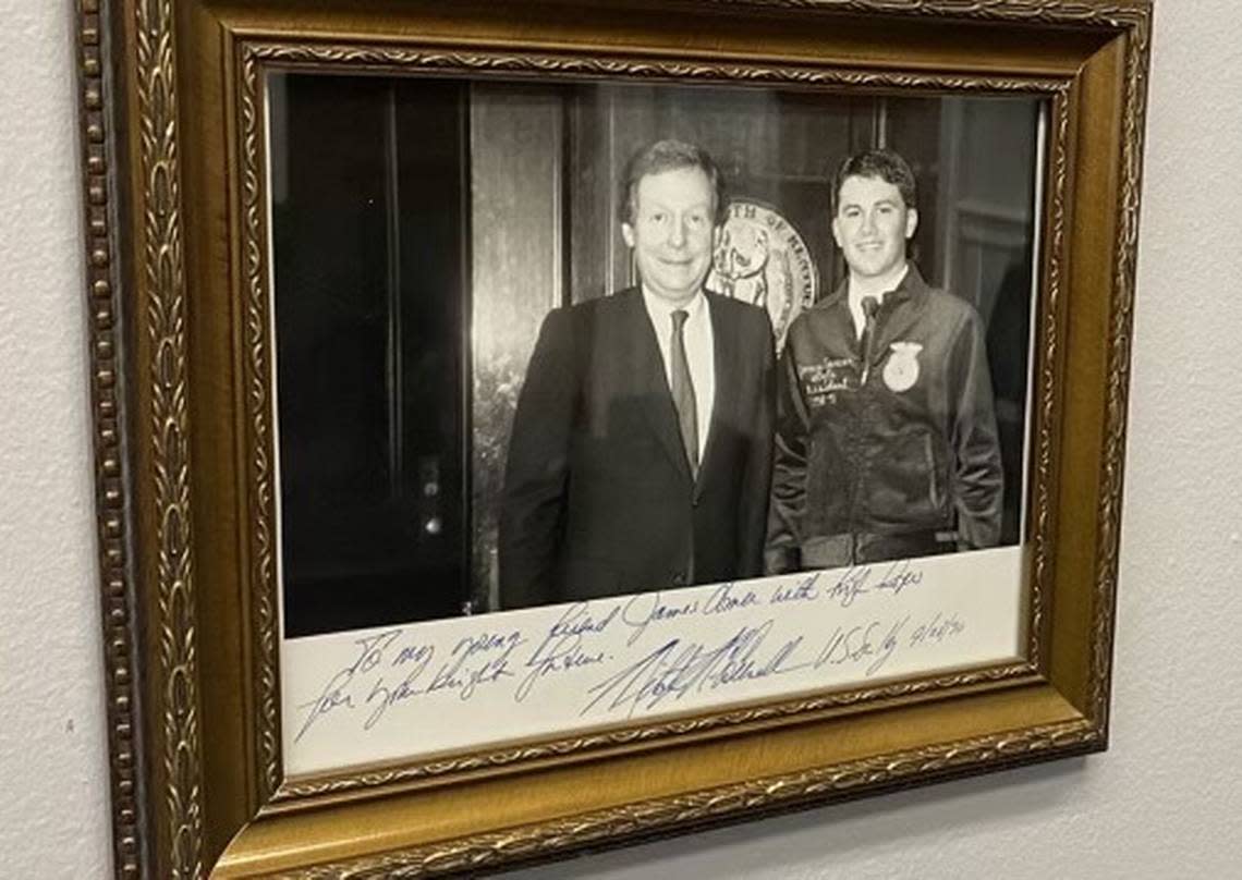 A photo of Senator Mitch McConnell with James Comer when Comer, as a college student, was the Kentucky Future Farmers of America president.