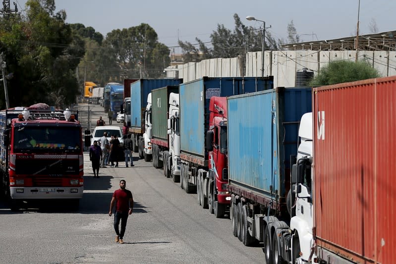 Trucks loaded with equipment for a U.S charity tent hospital under construction, arrive into Gaza