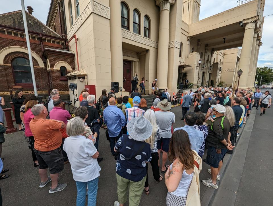 Residents waiting outside to hear the verdict on the bin tax.