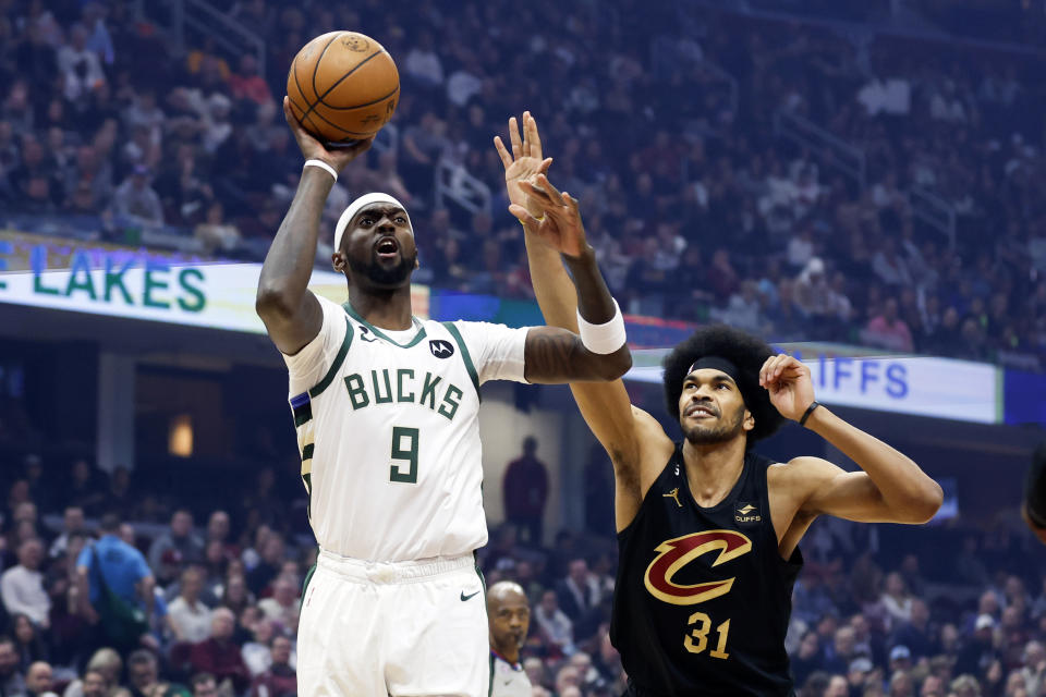 Milwaukee Bucks forward Bobby Portis (9) shoots against Cleveland Cavaliers center Jarrett Allen (31) during the first half of an NBA basketball game, Saturday, Jan. 21, 2023, in Cleveland. (AP Photo/Ron Schwane)