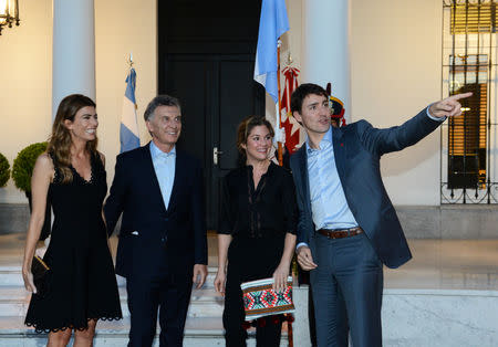 Canada's Prime Minister Justin Trudeau gestures alongside his wife Sophie Gregoire Trudeau, Argentina's President Mauricio Macri and his wife Juliana Awada at the Olivos Presidential Residence ahead of the G20 leaders summit in Buenos Aires, Argentina November 29, 2018. Picture taken November 29, 2018. Argentine Presidency/Handout via REUTERS