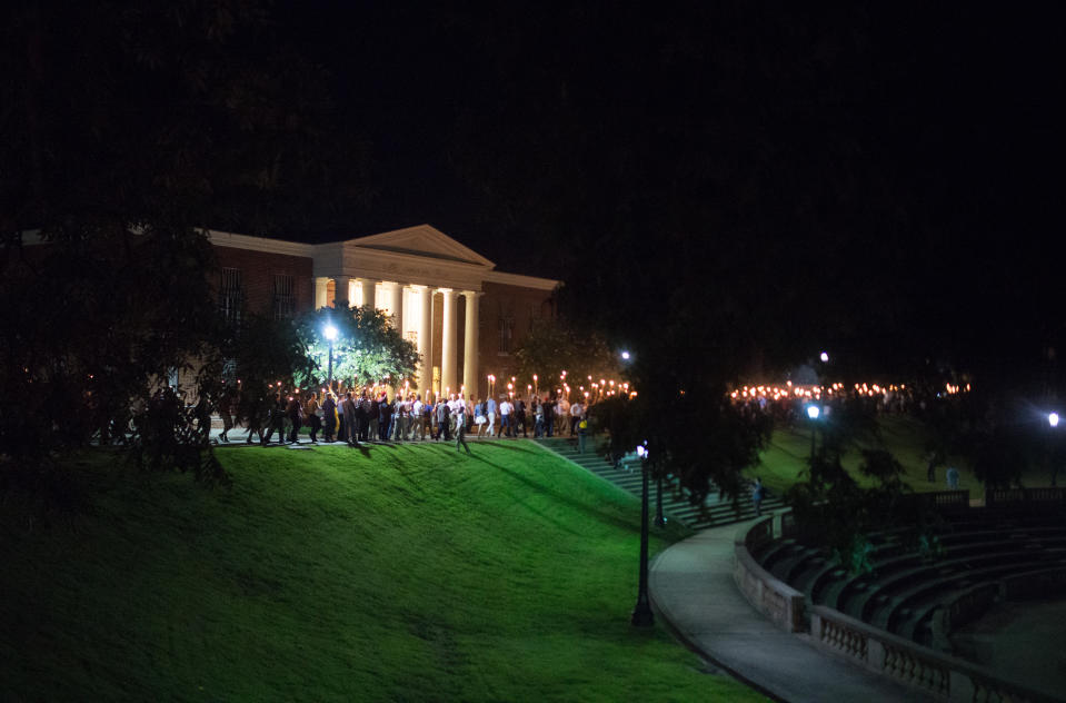 <p>Neo-Nazis, Alt-Right, and White Supremacists take part the night before the ‘Unite the Right’ rally in Charlottesville, Va. White supremacists march with tiki torchs through the University of Virginia campus, Aug. 11, 2017. (Photo: Zach D. Roberts/NurPhoto via Getty Images) </p>
