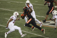 Oregon State running back Jermar Jefferson (6) weaves past Washington State linebacker Justus Rogers (37) and linebacker Brennan Jackson (80) during the second half of an NCAA college football game in Corvallis, Ore., Saturday, Nov. 7, 2020. Washington State won 38-28. (AP Photo/Amanda Loman)