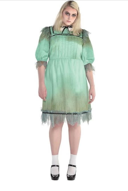 Model wears Dreadful Darling costume with green stained dress and black maryjane shoes