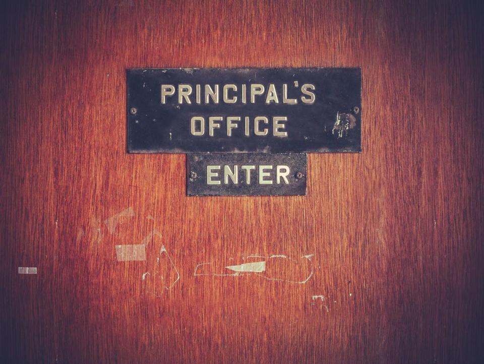 Photo illustration of a principal’s office door.