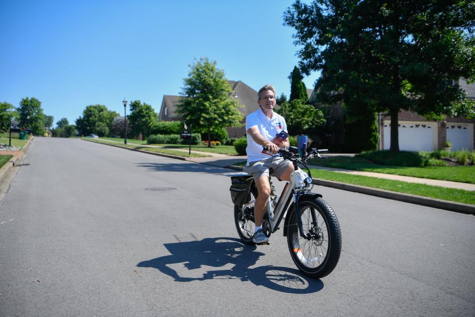 Chris Spencer, candidate for State Senator in district 18, rides his electric bike in the Somerset Downs neighborhood in Hendersonville, Tenn., Thursday, June 13, 2024.