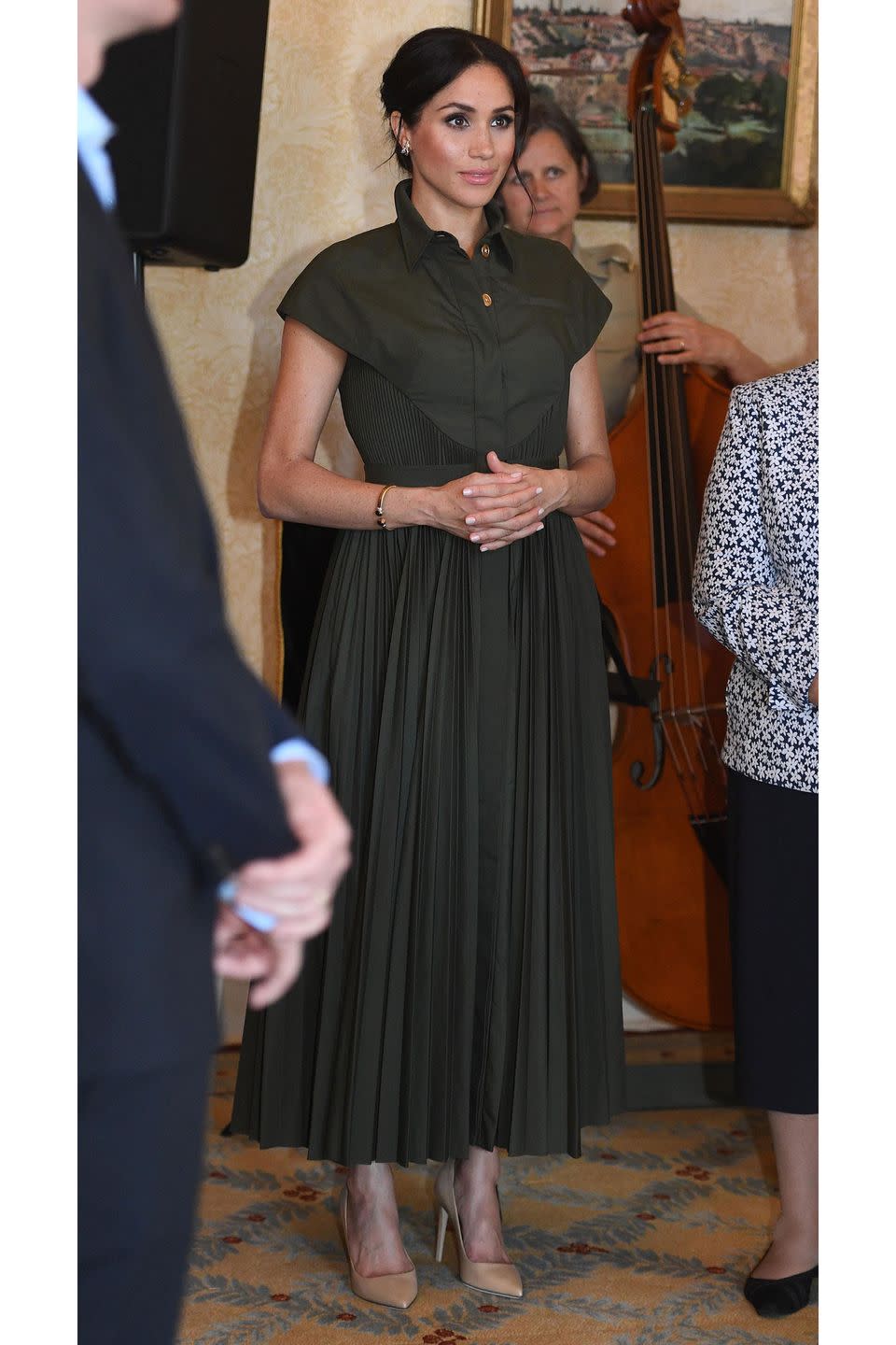 <p><strong>October 2018 </strong>Meghan wore a green pleated dress with nude heels as she attended a reception at Admiralty House.</p>