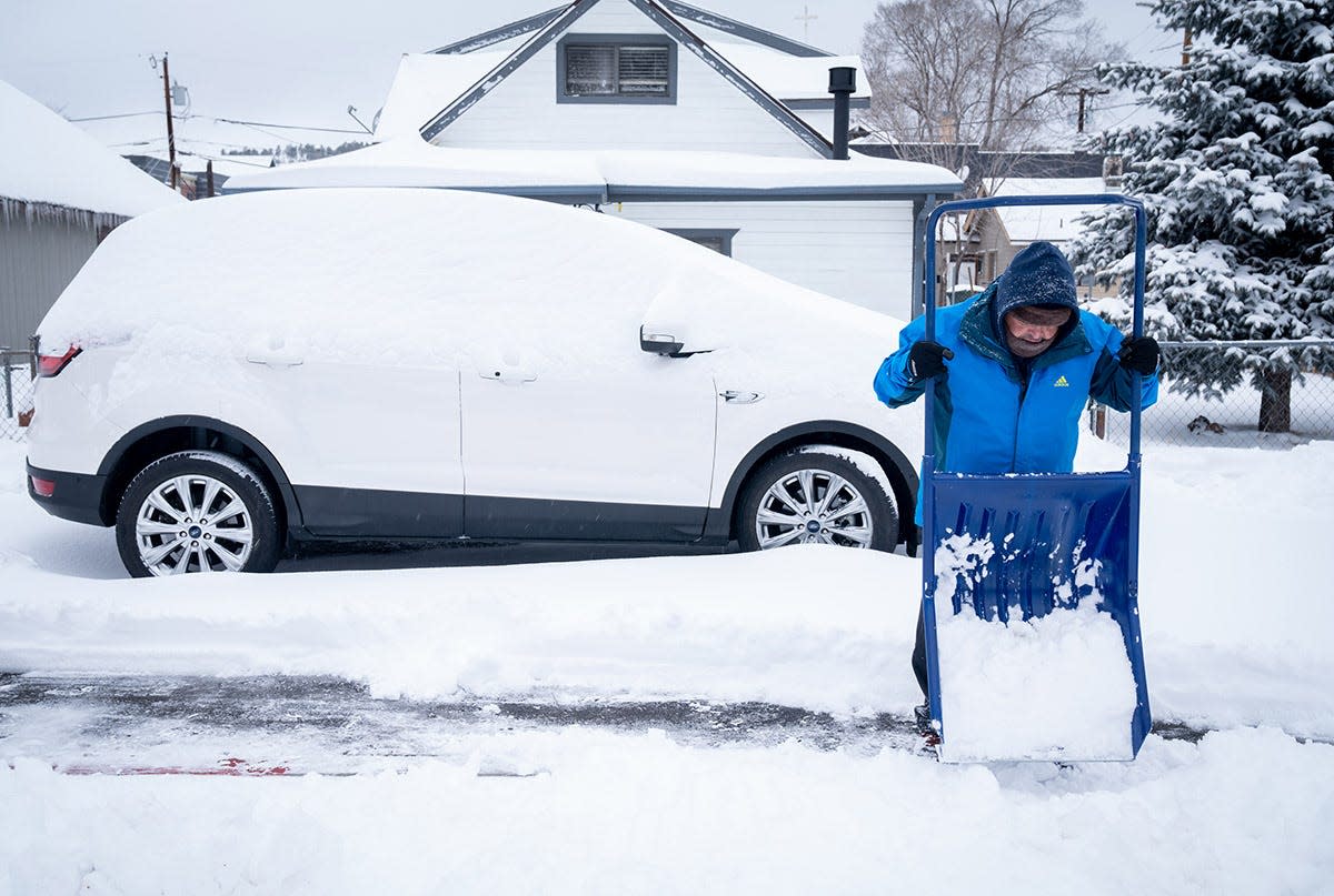 Reuben Salazar clears snow from his home in Flagstaff on Feb. 23, 2022.