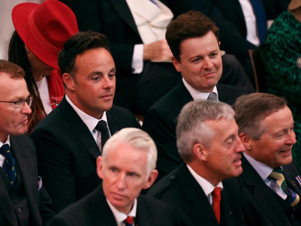 British television presenting duo Ant and Dec sit as guests wait during the coronation of King Charles