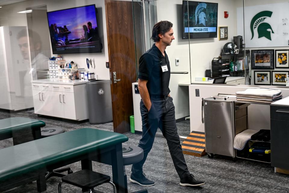 Michigan State hockey trainer Andy Hosler walks through the traning room during a tour of the Munn Ice Arena completed renovations on Friday, Sept. 23, 2022, at in East Lansing.