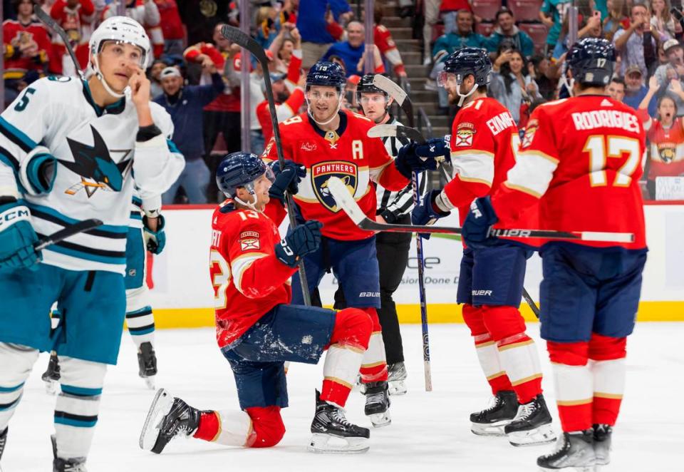 Florida Panthers center Sam Reinhart (13) celebrates with his teammates after scoring a goal against San Jose Sharks goaltender Mackenzie Blackwood (29) in the second period of their NHL game at the Amerant Bank Arena on Tuesday, Oct. 24, 2023, in Sunrise, Fla.