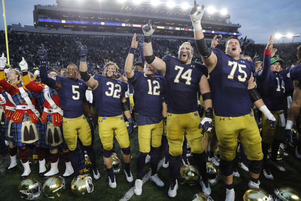 Members of the Notre Dame football team sing at the end of an NCAA college football game against Virginia Tech, Saturday, Nov. 2, 2019, in South Bend, Ind. Notre Dame won 21-20. (AP Photo/Carlos Osorio)