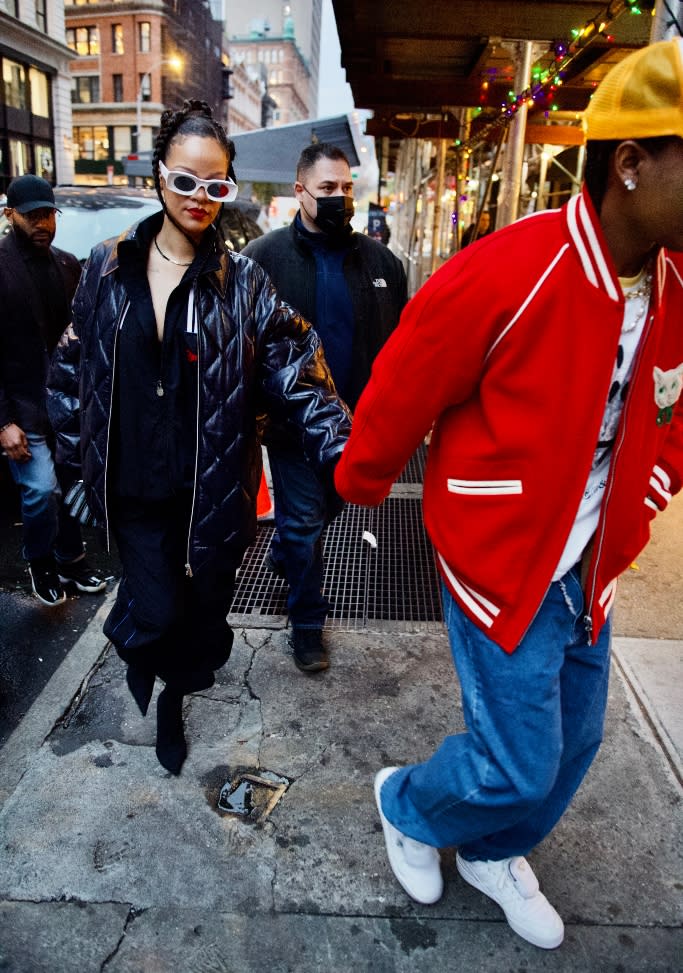 A$AP Rocky leads the way for Rihanna as they hit the pavement for some retail therapy in the Big Apple. - Credit: Splash