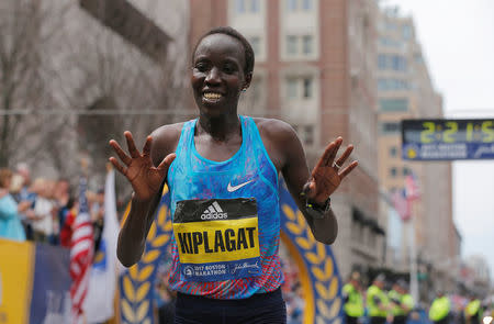 Edna Kiplagat of Kenya crosses the finish line to win the women’s division of the 121st Boston Marathon in Boston, Massachusetts, U.S., April 17, 2017. REUTERS/Brian Snyder