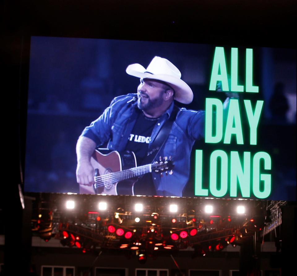 Garth Brooks opens his concert with "All Day Long" to an enthusiastic crowd at Donald W. Reynolds Razorback Stadium in Fayetteville