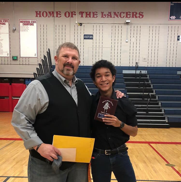 Marc Small and his football coach. (Photo courtesy of Marc Small)