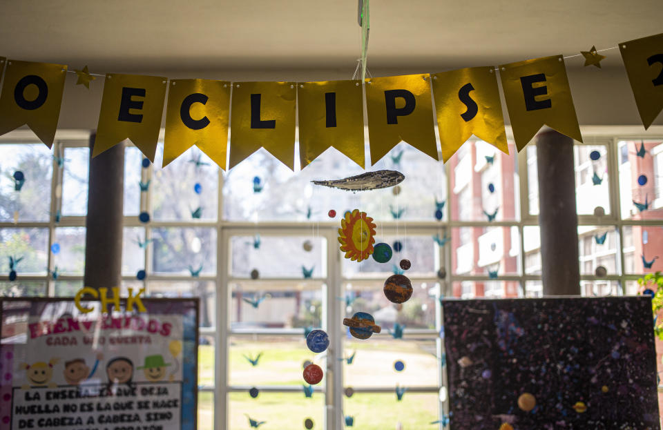 The entrance of the Helen Keller School is festooned with eclipse themed decorations during sensorial experience for the blind, with tools created by NASA and Edinburgh University to experience an eclipse, at the Helen Keller school in Santiago, Chile, Tuesday, June 25, 2019. The event comes exactly one week ahead of a total solar eclipse which is set to be fully visible in various South American countries, including Chile. (AP Photo/Esteban Felix)