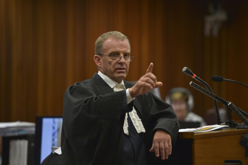 Prosecutor Gerrie Nel asks questions in court about the events surrounding the shooting death of Oscar Pistorius' girlfriend Reeva Steenkamp, in court during the second week of his trial in Pretoria, South Africa, Wednesday, March 12, 2014. Pistorius is charged with the shooting death of Steenkamp, on Valentines Day in 2013. (AP Photo/Alexander Joe, Pool)