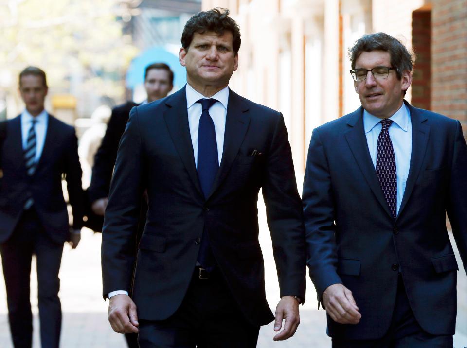 Gordon Caplan, center, arrives at federal court Tuesday, May 21, 2019, in Boston, where he is scheduled to plead guilty to charges in a nationwide college admissions bribery scandal. (AP Photo/Michael Dwyer) ORG XMIT: BX102