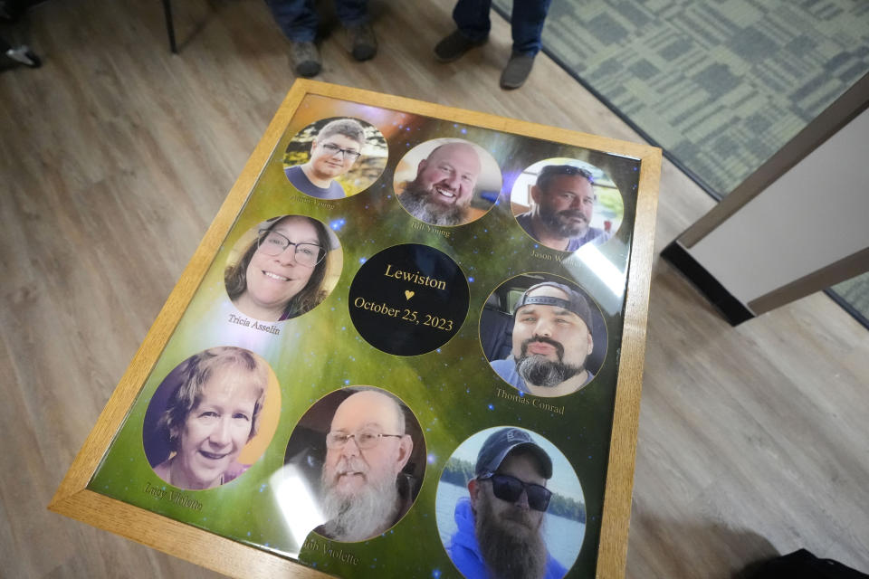 The eight people who were killed last October while bowling at Just In Time Recreation are memorialized on a table top at the bowling alley, Wednesday, May 1, 2024, in Lewiston, Maine. (AP Photo/Robert F. Bukaty)