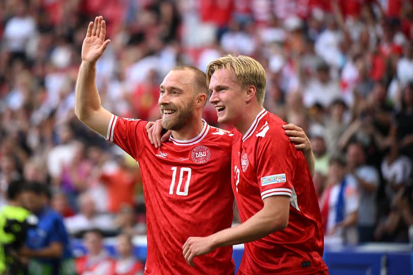 Victor Kristiansen celebrates with Christian Eriksen after Denmark's goal in their 1-1 draw with Slovenia at Euro 2024