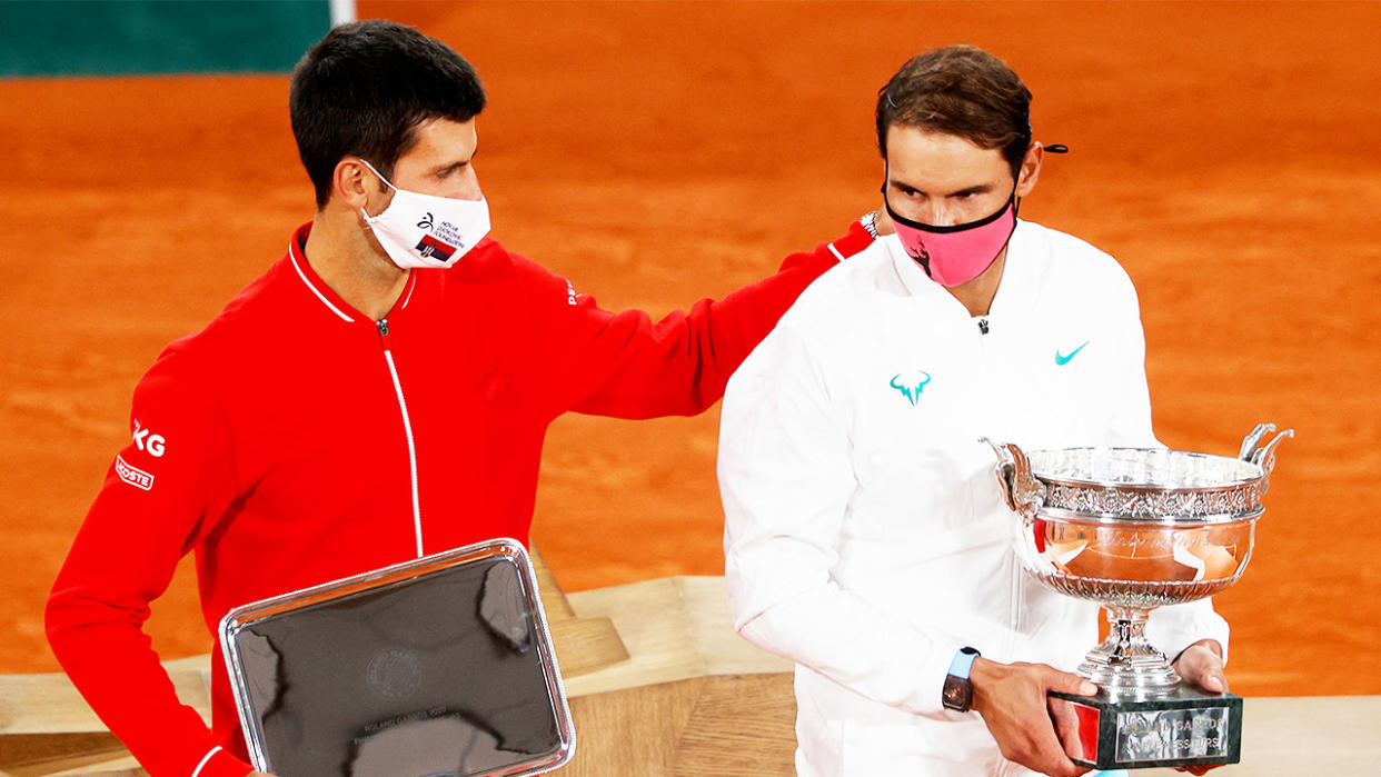 Novak Djokovic (pictured left) puts his arm on Rafa Nadal (Pictured right) after losing the French Open final.