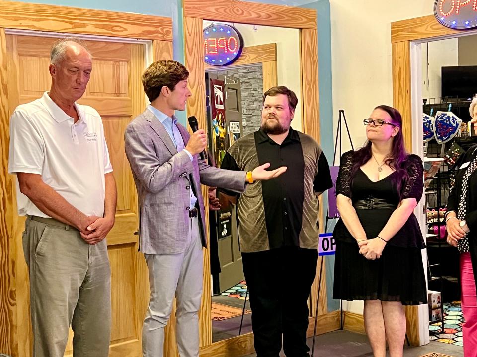 Mayor Chaz Molder, second from left, speaks to Muletown Hobbies and Games co-founders Michael Waggoner and Mandi Duncan as the shop opens in the Columbia Arts Building on Tuesday, Sept. 19, 2023.