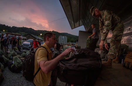 FILE PHOTO: U.S. Army Soldiers unload their luggage and equipment upon arriving at Yongin, South Korea, after nearly 24 hours of travel, security lines and briefings to participate in a two-week training exercise, August 22, 2016. Courtesy Ken Scar/U.S. Army/Handout via REUTERS