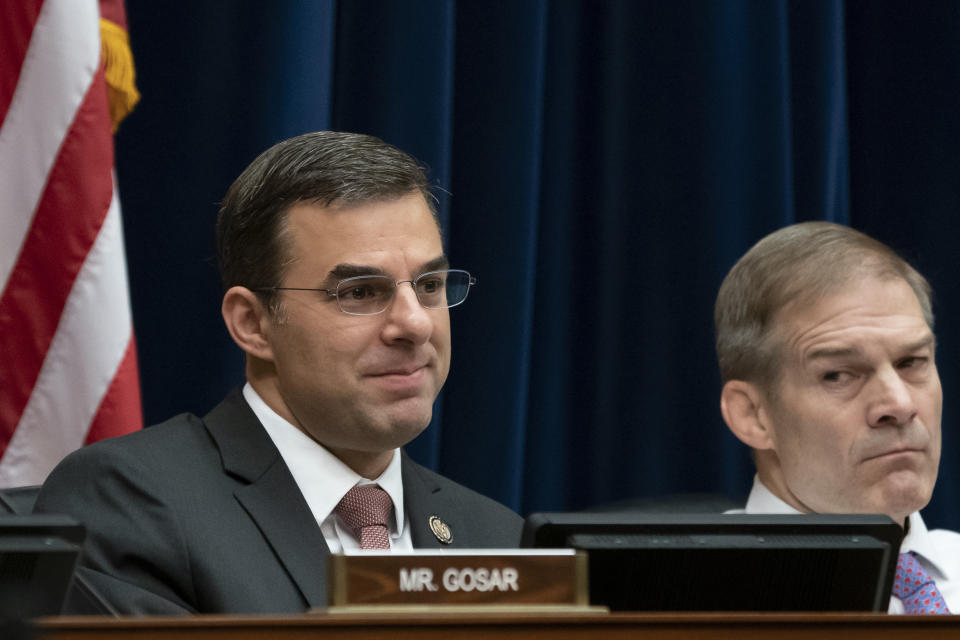 Rep. Justin Amash, R-Mich., left, joined at right Rep. Jim Jordan, R-Ohio, the ranking member, by votes with Democrats on the House Oversight and Reform Committee to subpoena presidential counselor Kellyanne Conway for not appearing before the panel after allegations that she repeatedly violated the Hatch Act, a federal law that limits political activity by government workers, on Capitol Hill in Washington, Wednesday, June 26, 2019. Back in May, Rep. Amash, a co-founder of the conservative Freedom Caucus, became the first Republican member of Congress to suggest that President Donald Trump should be impeached, putting him at odds with the GOP. (AP Photo/J. Scott Applewhite)