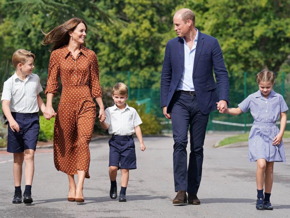 Prince George, Kate Middleton, Prince Louis, Prince William, and Princess Charlotte walk to school.