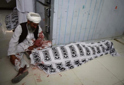 A Pakistani man mourns the death of a relative after a bomb blast at an election rally, at a hospital in Quetta on July 13, 2018