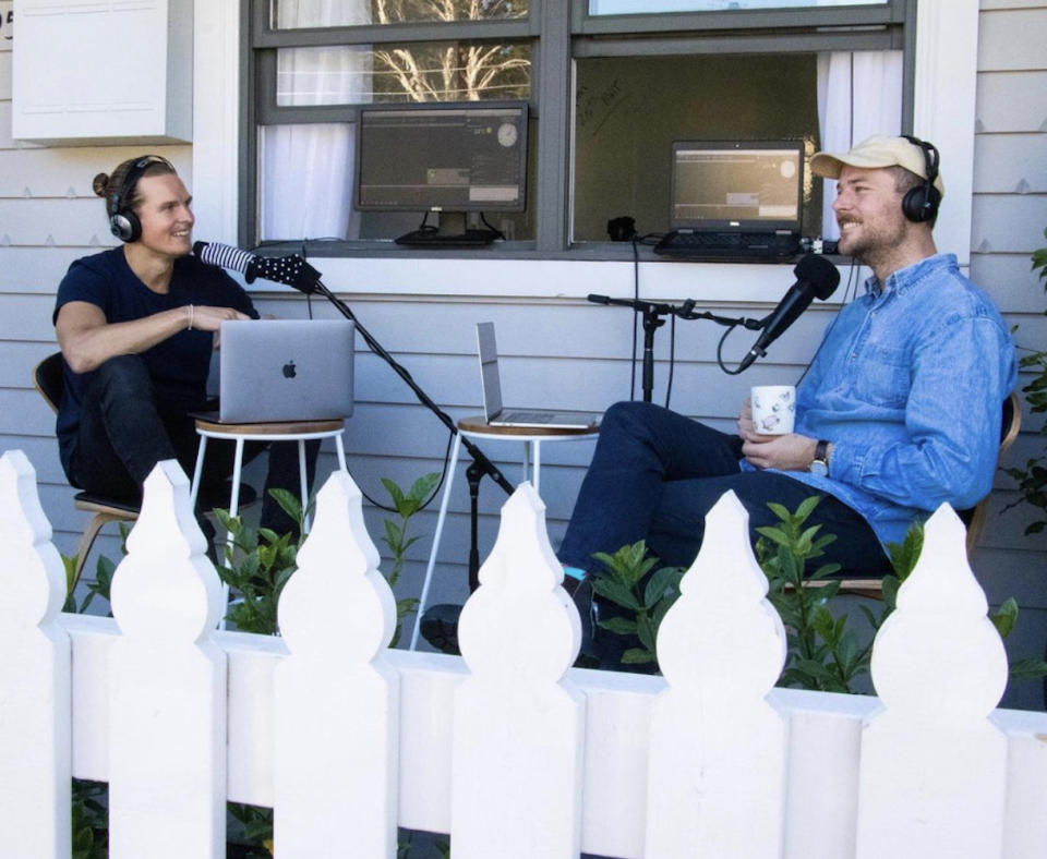 Will and Woody from KiiS radio station sitting in front of computers and microphones outside 