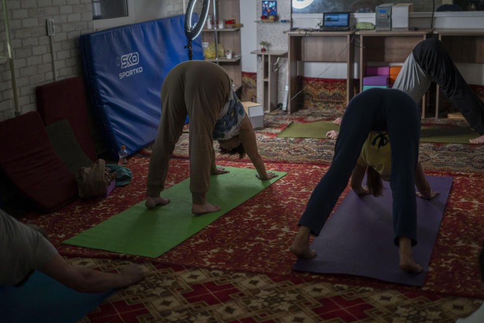 Women practise yoga in a basement in Kramatorsk, Donetsk region, Ukraine, Thursday, Sept. 14, 2023. People in the front-line Ukrainian city of Kramatorsk gather three times a week for yoga session to alleviate the stress caused by Russia’s persistent shelling. (AP Photo/Hanna Arhirova)